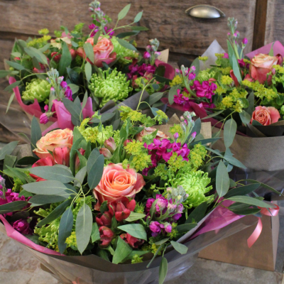 Designer's Choice Vibrant - Let our florist choose a stunning, vibrant selection of flowers to arrange into a beautiful hand-tied bouquet.