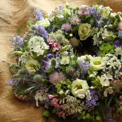 Seasonal Wreath - Let our team of florists choose a seasonal selection of flowers to say farewell to a loved one.