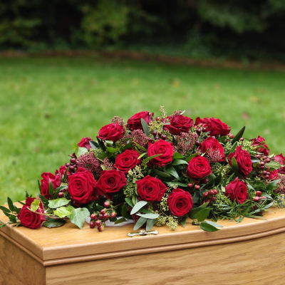 Rose Casket Spray - Beautiful casket spray of stunning roses mixed with seasonal foliage.